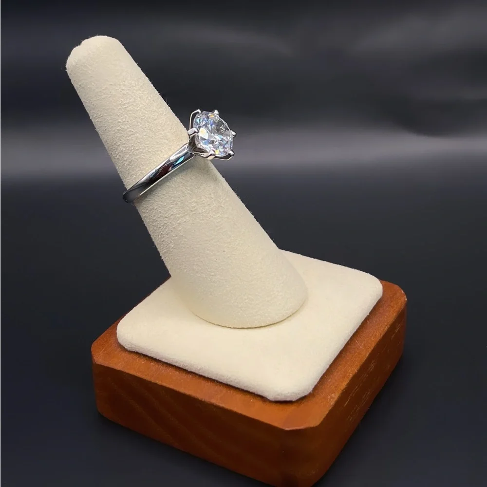 Two (2) carat cz solitaire in a 925 sterling silver setting. Size 6.25.